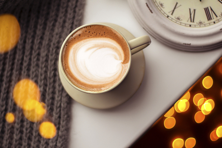 Top view of hot coffee cappuccino latte art in a ceramic glassの写真素材