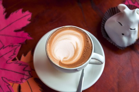 Top view of hot coffee cappuccino latte art in a ceramic glassの写真素材