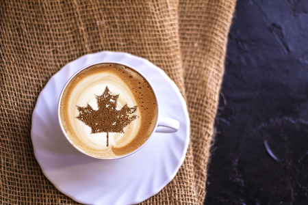 July 1 Independence Day Canada drawing a clover on a cup of coffeeの写真素材