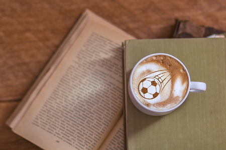 Coffee cappuccino in a cup for breakfast for a football fanの写真素材