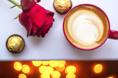 a cup of cappuccino coffee in a ceramic cup on the tableの写真素材