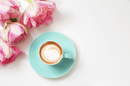 a cup of cappuccino coffee in a ceramic cup on the tableの写真素材