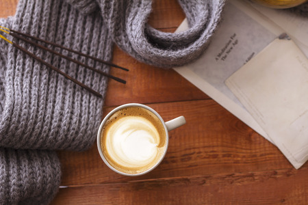 a cup of cappuccino coffee in a ceramic cup on the tableの写真素材