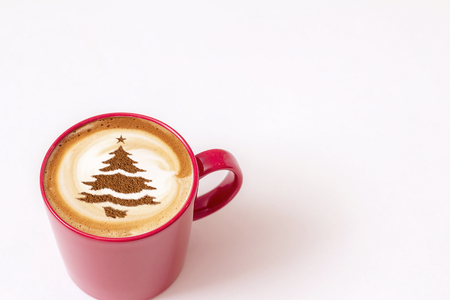 cup of Christmas cappuccino coffee with a Christmas tree patternの写真素材