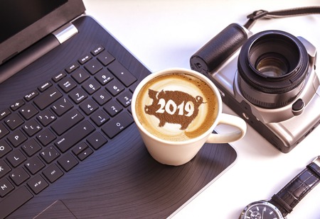 coffee cappuccino in a cup with a pattern of the symbol of 2019 pig on milk foam. The pig is a symbol of the year 2019 in the Chinese calendar.の写真素材