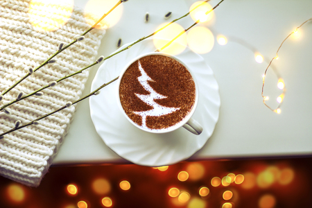christmas tree drawing on latte art coffee cup on a conceptual backgroundの写真素材