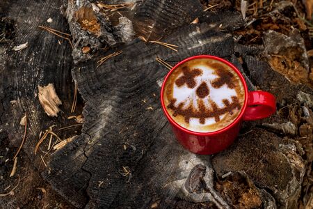 Halloween coffee concept, Female hipster is holding Pumpkin head jack 'o lantern coffee.