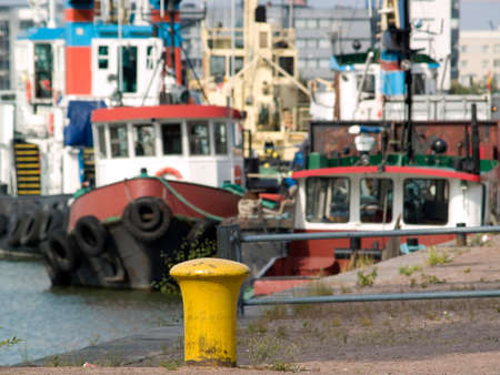 Several towboats moored in one of Helsinki harboursの写真素材