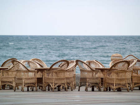 Rattan Chairs and Furniture Bar Empty on Beach