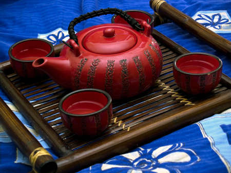 Oriental tea ceremony set with cups on bamboo tray
