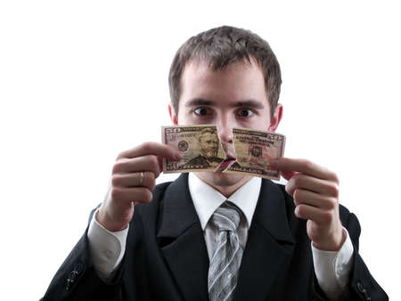 Businessman holding broken dollar bank note isolated whiteの写真素材