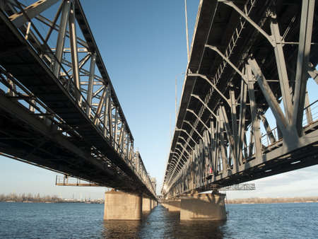 Steel railroad old bridge perspective from bottomの写真素材
