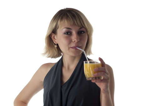 Beautiful young blonde lady drinking orange juice