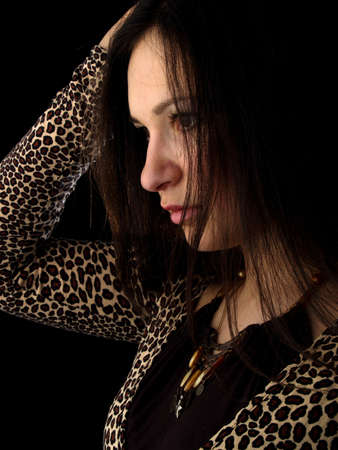 Young beautiful brunette woman portrait isolated on blackの写真素材