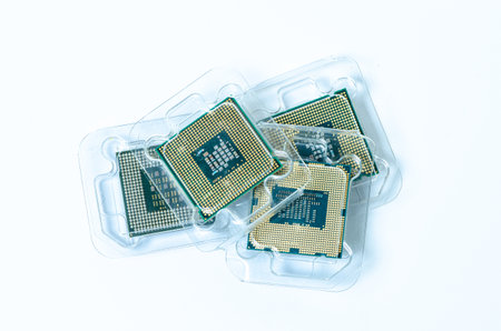 Computer processor CPU Central processing unit microchip isolated on white background Closeup the bottom side, socket contact for personal computerの写真素材