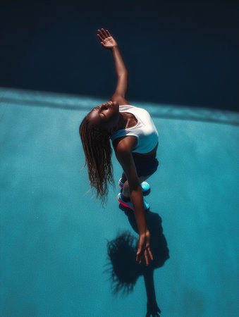High angle view of a young African American female athlete training on a workout field.の素材