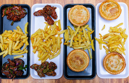 Delicious and tasty food on a wooden table. Top view.