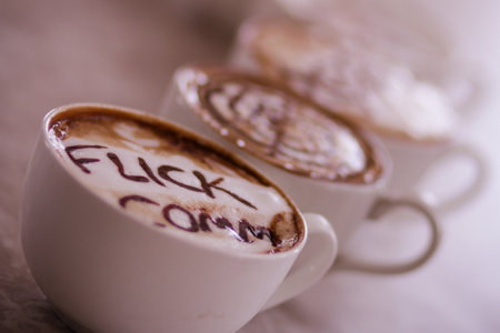 Two cups of cappuccino with the word love on itの写真素材