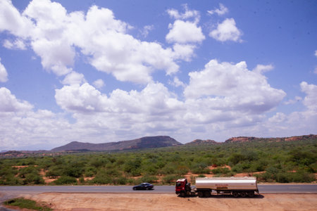 A truck driving on the road in the Kgalagadi Transfrontier Park, South Africaの写真素材