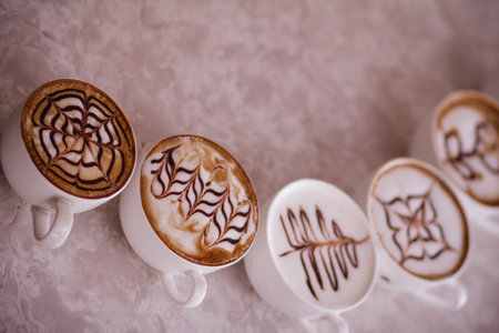 Coffee cups with latte art on the table. High quality photoの写真素材