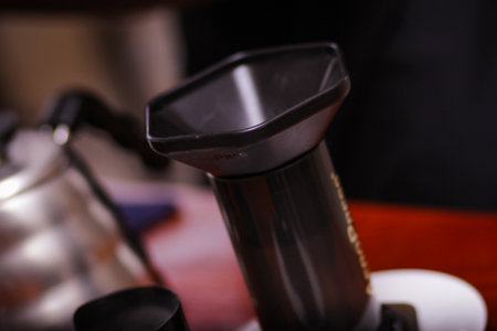 Professional barista brewing coffee in a coffee shop, close-upの写真素材