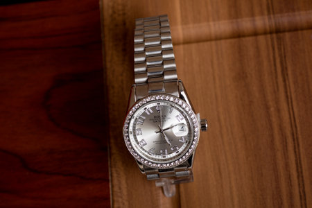 Luxury men's wristwatch on a wooden background. Selective focus.の写真素材
