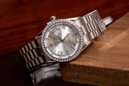 Luxury watch on a wooden table, close-up.の写真素材