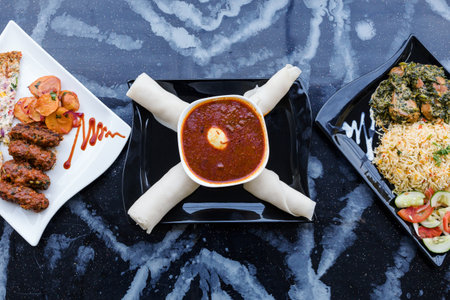 Malaysian food in a black plate on a marble table.の写真素材
