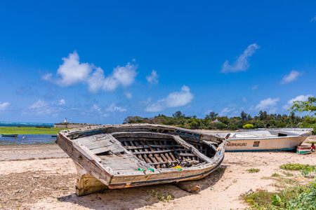 Abandoned fishing boat on the beach of Zanzibar, Tanzaniaの写真素材