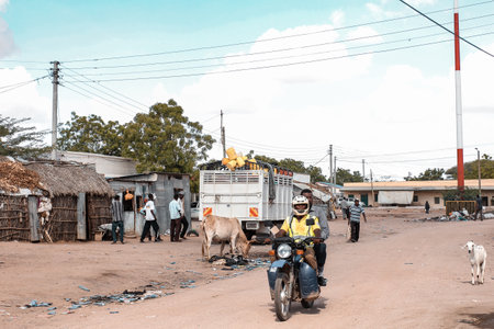 Local people riding a motorbike in Nairobi, Kenyaの写真素材