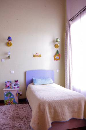 Interior of a children's room with a bed and toys.の写真素材