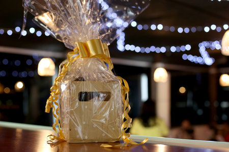 Gift box on the table in the restaurant with bokeh background