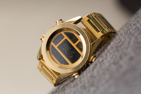 close up gold wristwatch on gray background, shallow depth of fieldの写真素材