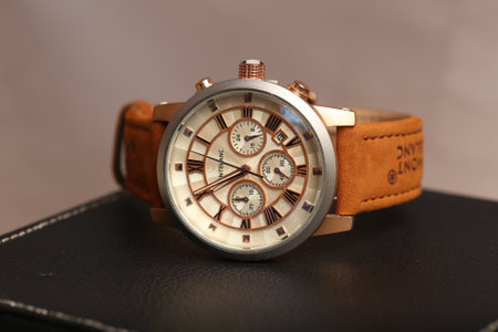 Luxury wrist watch on a black leather case close-up