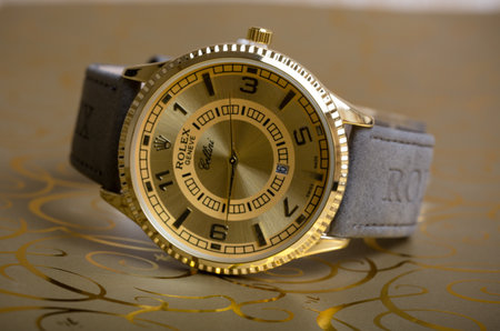 Luxury wristwatch on gold background. Selective focus.の写真素材