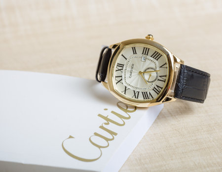 Wristwatch on a white box with the inscription COUPLEの写真素材