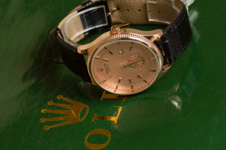 Wristwatch on a green background, close-up, macroの写真素材