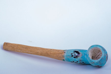 Old smoking pipe on a white background with copy space for text.の写真素材