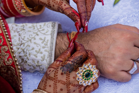 Hands of indian bride and groom with henna on their wedding dayの写真素材