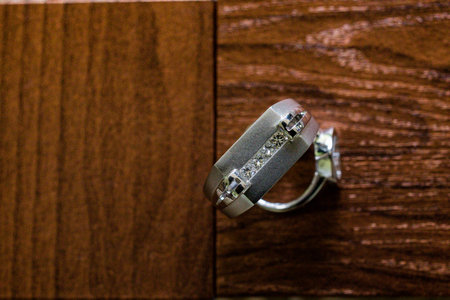 Jewelry ring on a wooden background. Selective focus.