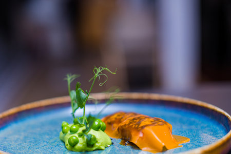 Close up of a piece of salmon caviar on a plate.の写真素材