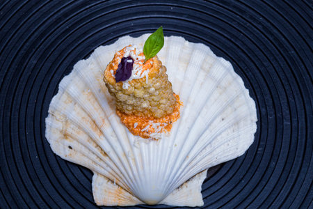 Cream cheese tartare with scallop on a black background