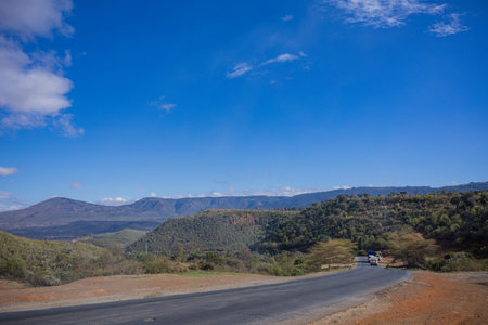 Landscape view of the road in the mountains, with blue skyの写真素材