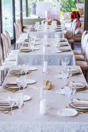 Table set for wedding or another catered event dinner in a restaurantの写真素材