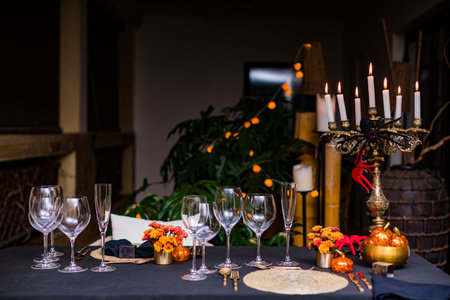 Festive table setting for Halloween party in the interior of the restaurantの写真素材