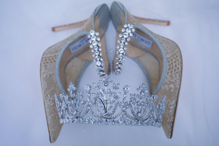 Wedding shoes with a crown on a white background. Wedding accessories.の写真素材
