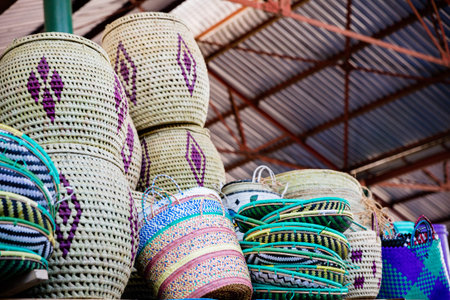 Colorful hand woven baskets for sale at a market in Thailand.