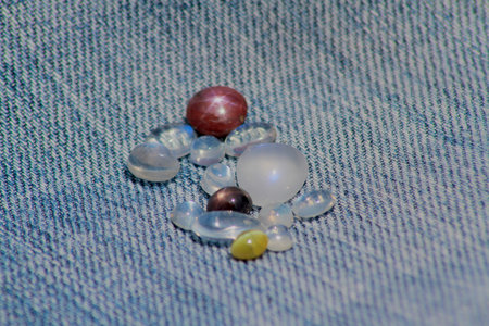 Closeup view of gemstones including star ruby, star sapphire, cats eye and blue moonstones kept on a...