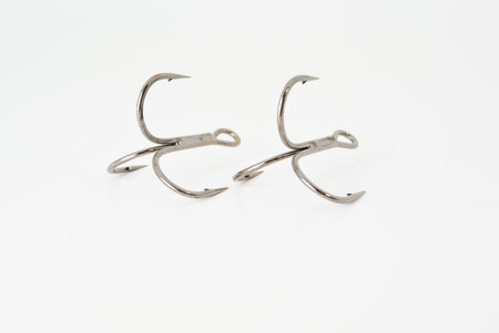 two jig triple hooks on white texture