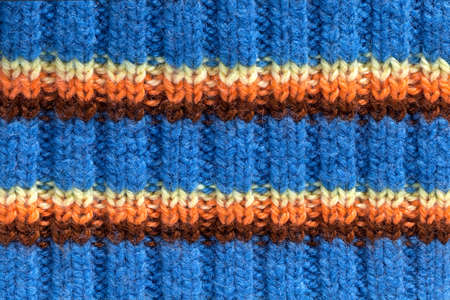 Knitted wool texture, colorful striped background, handmadeの写真素材